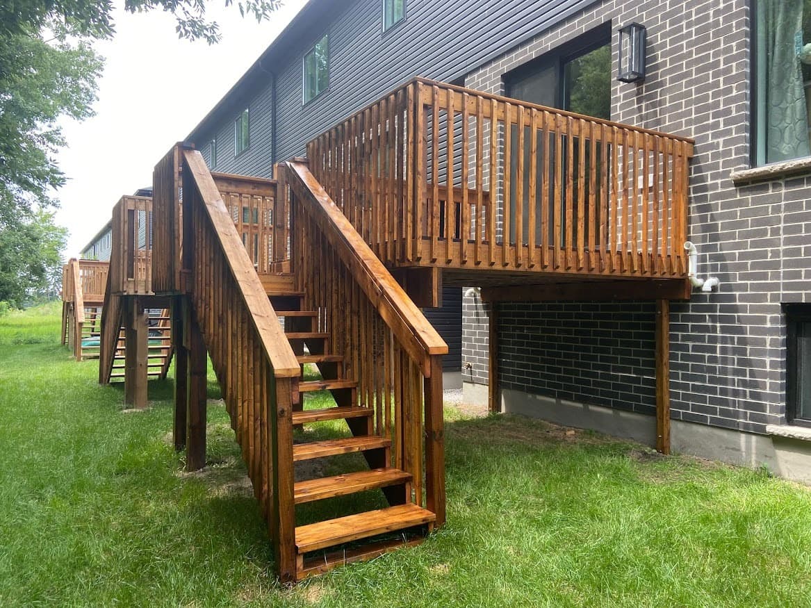 Deck Restaining team performing professional deck staining in Oakville, Ontario